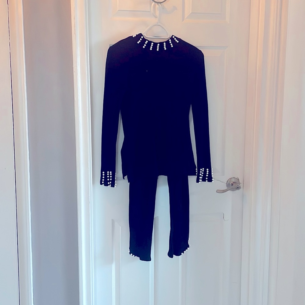 Black 2 piece turtle neck set with pearls on the sleeves and pants